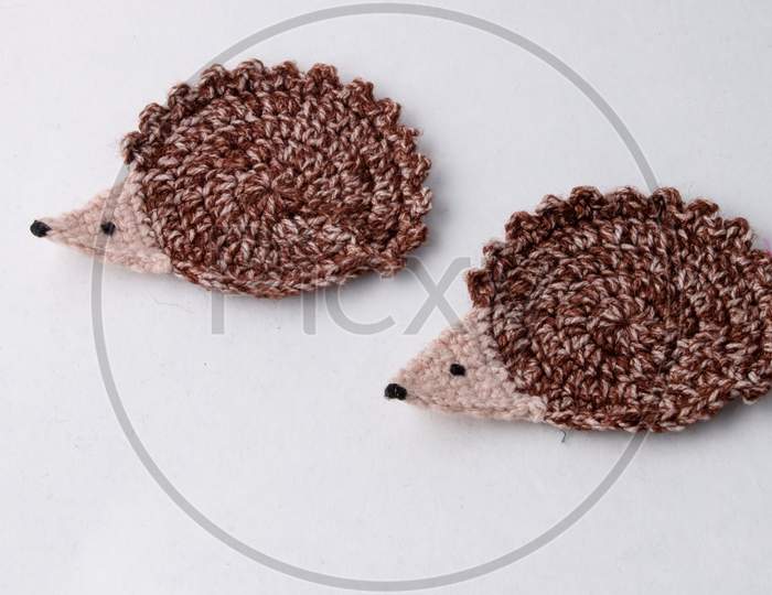 2 Cute Brown Woollen Hedgehog , Handmade Craft Of Crochet, Isolated On White