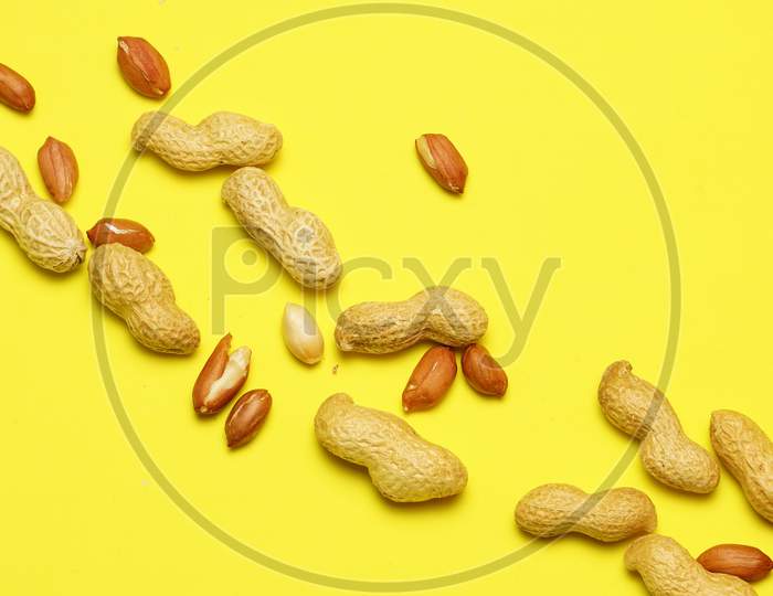 Top View Of Peanuts On Yellow Background With Copy Space. Food. Flat Lay