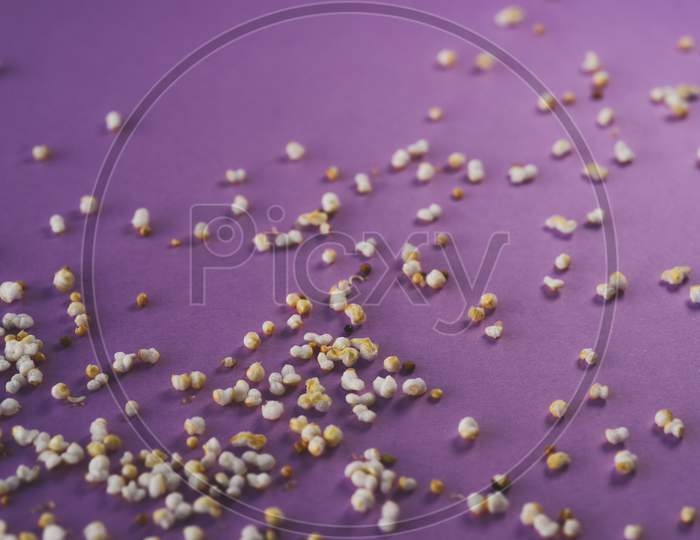 Organic Amaranth Seeds Over A Purple Background
