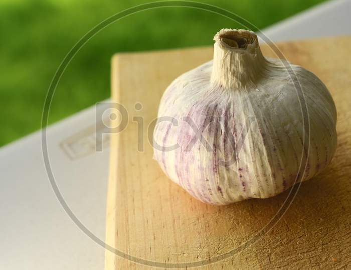 Nice Close Up Of Garlic On A Wooden Chopping Board