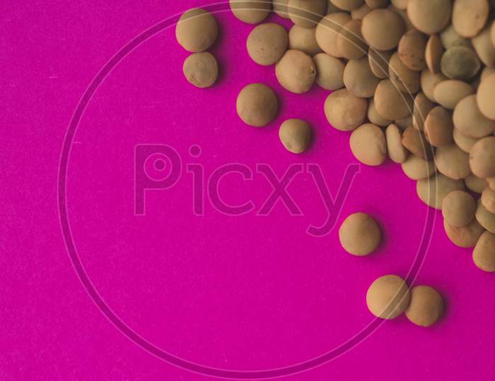 Many Raw Organic Lentil,  Pink Background