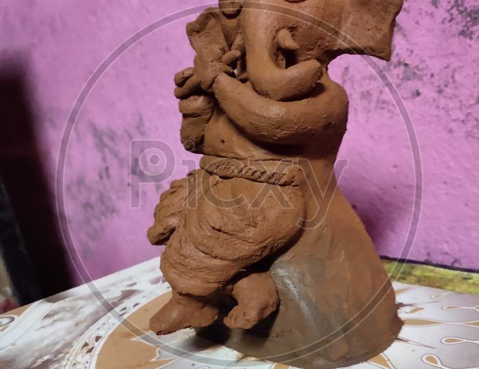 Ganesha art with red soil clay