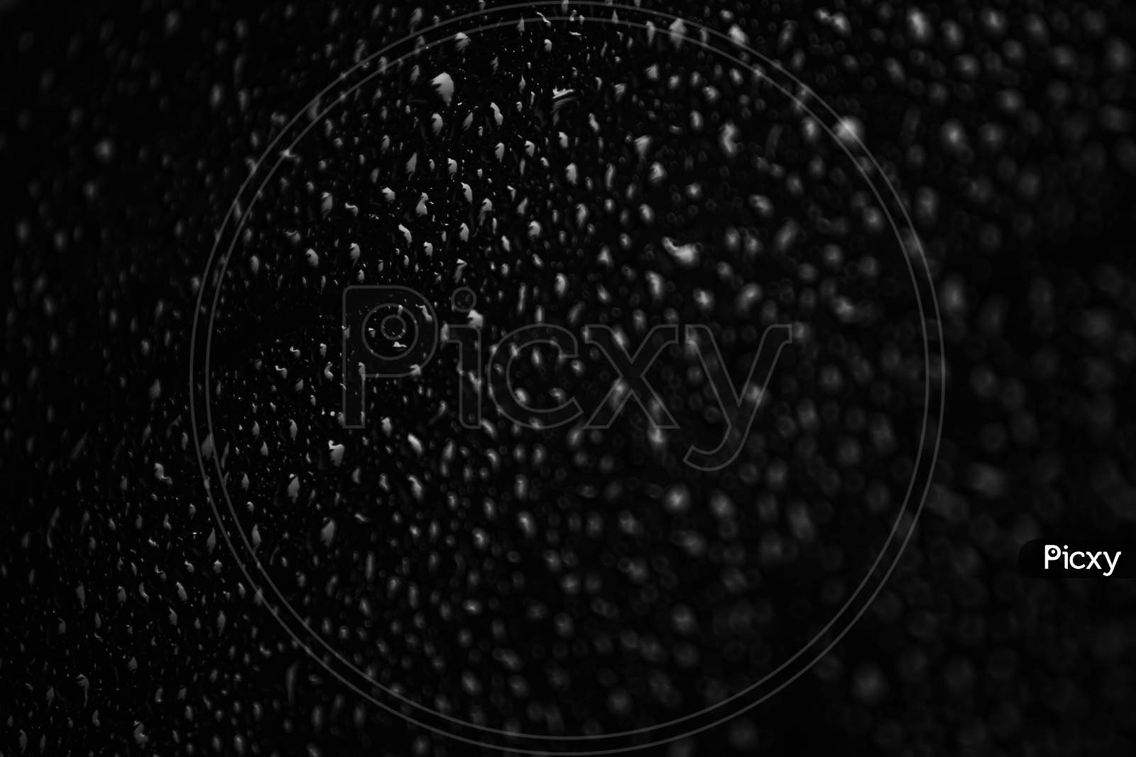 Flat Black Background With A Lot Of Black Water Drops