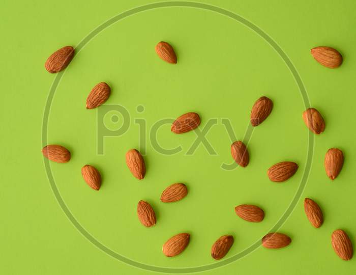 Almonds On A Green Background