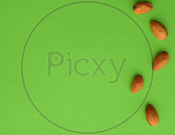 Almonds On A Green Background, Empty Space