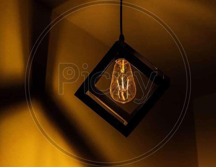 Light bulb enclosed in a cube
