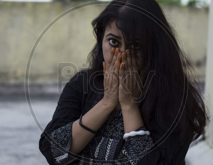 Indian Female Model Looking Down Unhappy Face With Copy Space For Text