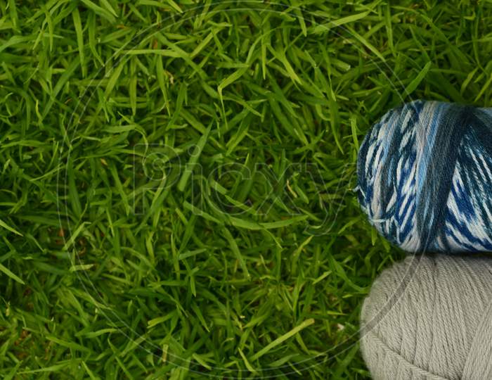 Top View Of Worsted Yarn On The Grass