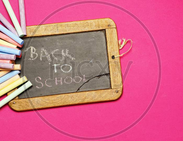 Blackboard With Back To School Message With Chalks. Flat Lay Flat Design