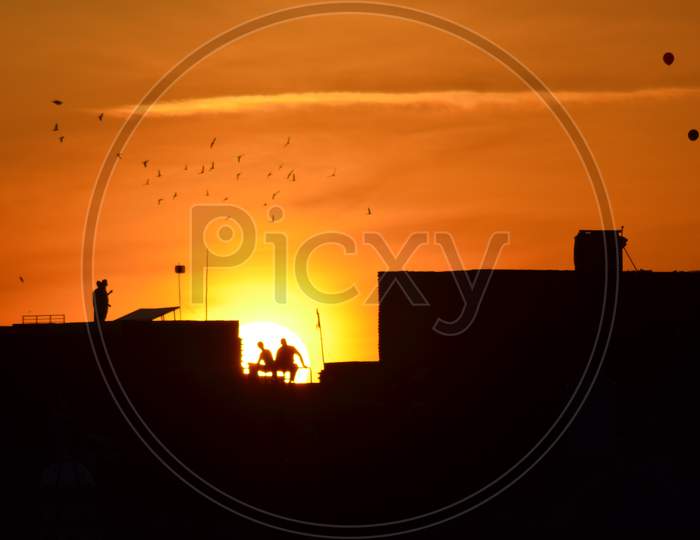 Sunset behind the people with scene photography