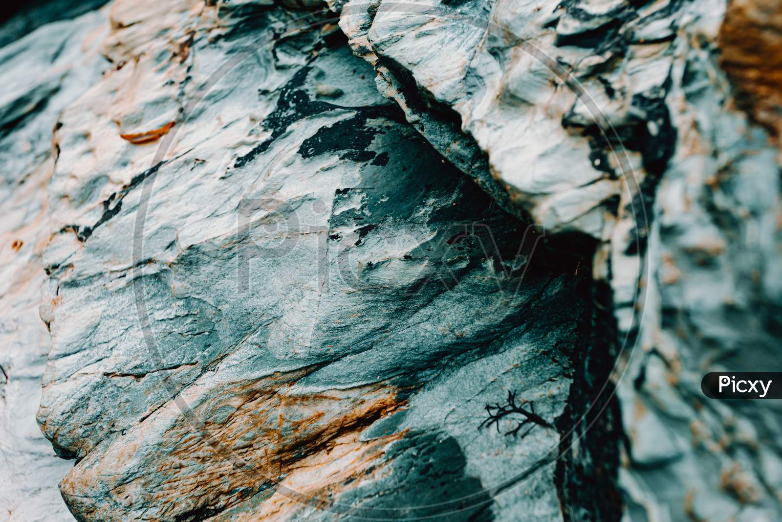 Close Up Background Of A Blue Rock With Brown Tones