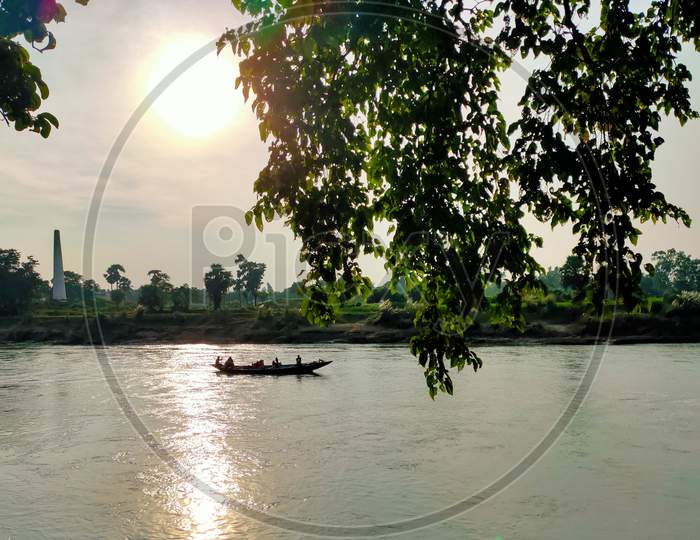 The beautiful river and a boat with sun