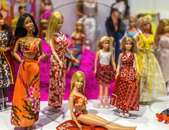 Darmstadt, Germany - September 16th 2020: A german photographer visiting Loop5, the biggest shopping mall in Hesse, taking pictures of an exhibition with different barbie dolls from 30 decades.