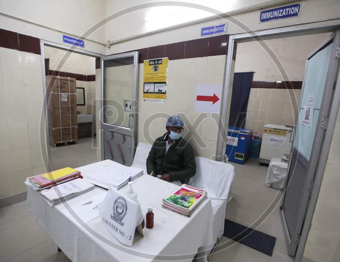 A healthcare worker make preparations inside a room at a vaccination center set up at a MCD maternity home ahead of a nationwide trial of a Covid-19 vaccine delivery system in New Delhi, India, on, Jan 1, 2021. India will test its Covid-19 vaccine delivery system with a nationwide trial on Jan 2.
