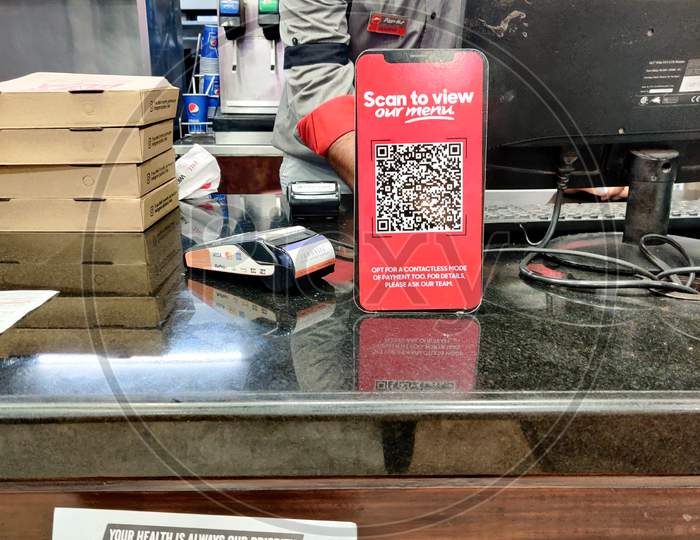 Cashier Counter Of Pizza Hut With Warnings To Maintain Distance And Qr Code To Access Digital Menu In The Middle Of The Covid 19 Coronavirus Pandemic In India Asia