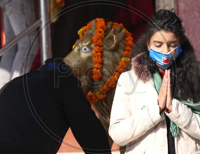 Woman,  pay obeisance at Kali Mata Temple on the first day of New Year 2021, in Jammu ,1 January,2021.