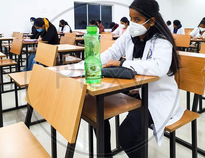 December 8, 2020.Lucknow Uttar Pradesh,India. West Bengal India. Medical Students Writing Examination Paper In Mask Maintaining Social Distancing At Radheshwam Medical College,Lucknow, Up, India