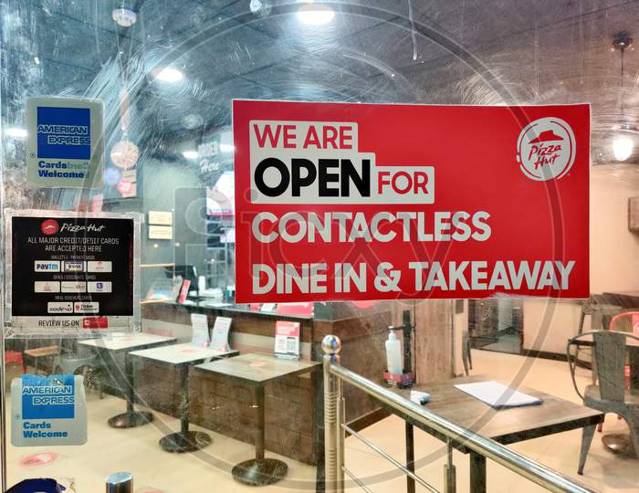 Sign On Pizza Hut Showing The Store Open For Contactless Delivery And Dine In Post The Covid19 Coronavirus Lockdown As Stores Open Up With The Vaccine Coming Up