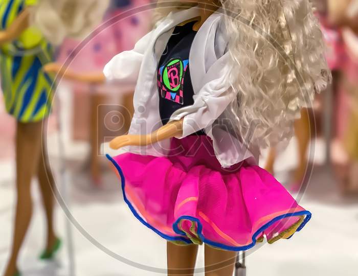 Darmstadt, Germany - September 16th 2020: A german photographer visiting Loop5, the biggest shopping mall in Hesse, taking pictures of an exhibition with different barbie dolls from 30 decades.