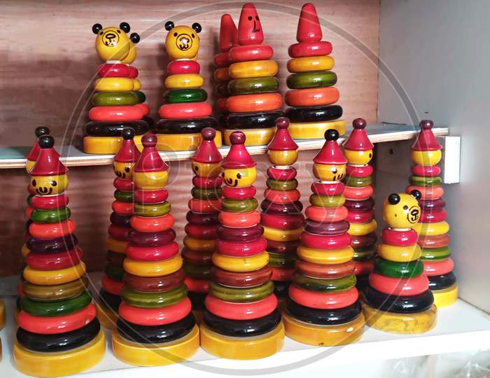 Colourful ring wooden stacking doll figures from Channapatna toy town