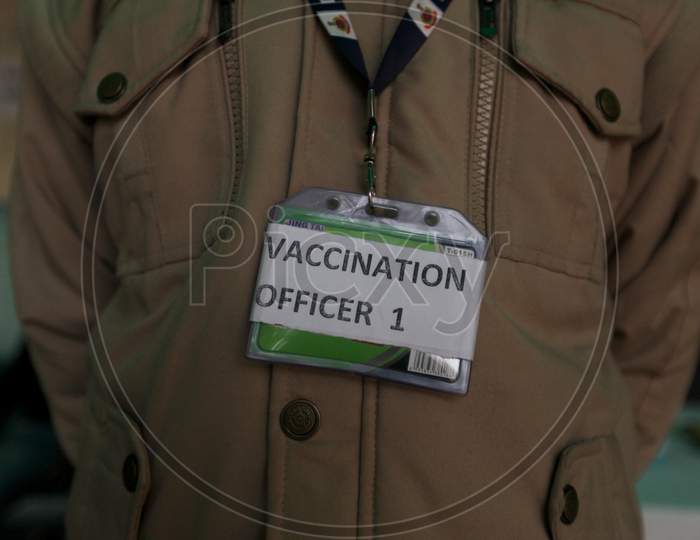 A Worker stands outside a vaccination center set up at a MCD maternity home ahead of a nationwide trial of a Covid-19 vaccine delivery system in New Delhi, India, on, Jan 1, 2021. India will test its Covid-19 vaccine delivery system with a nationwide trial on Jan 2