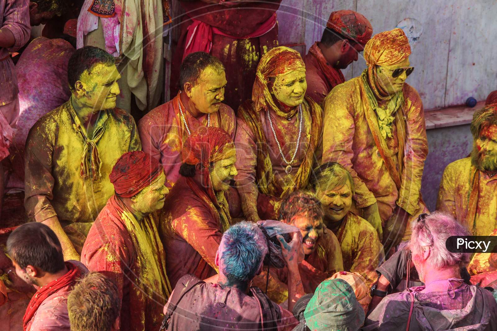 Mathura, Uttar Pradesh/ India- January 6 2020: Group Of Happy Friends Playing With Holi Colors Faces,Adults Having Fun At A Holi Festiva ,Foreigners Enjoying Festival In India And Foreigners Clicking Photos.
