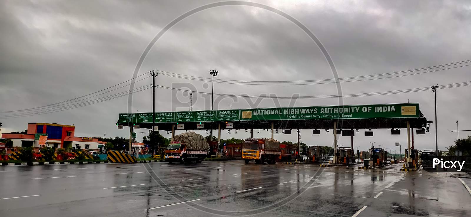 Perambalur , Tamil Nadu, India - December 4Th 2020: Busy Fastag Highway Toll Gate Checkpoint On Monsoon Rainy Day. Truck And Car Cross Highway Freeway Toll Gate.