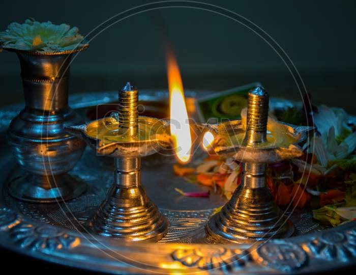 Beautiful Silver Old Lamp And Pooja Thali Decorated For Worshiping God.