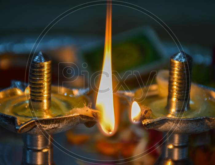 Close Up Of Beautiful Silver Oil Lamp On Blur Background