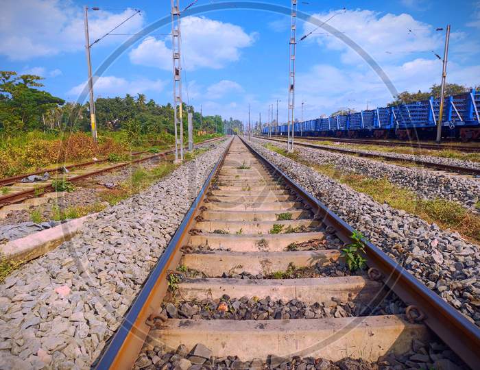 A railway line, plartform picture, nature view of track, blue sky