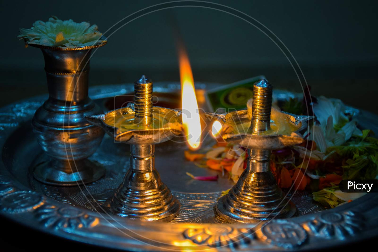 Beautiful Silver Old Lamp And Pooja Thali Decorated For Worshiping God.