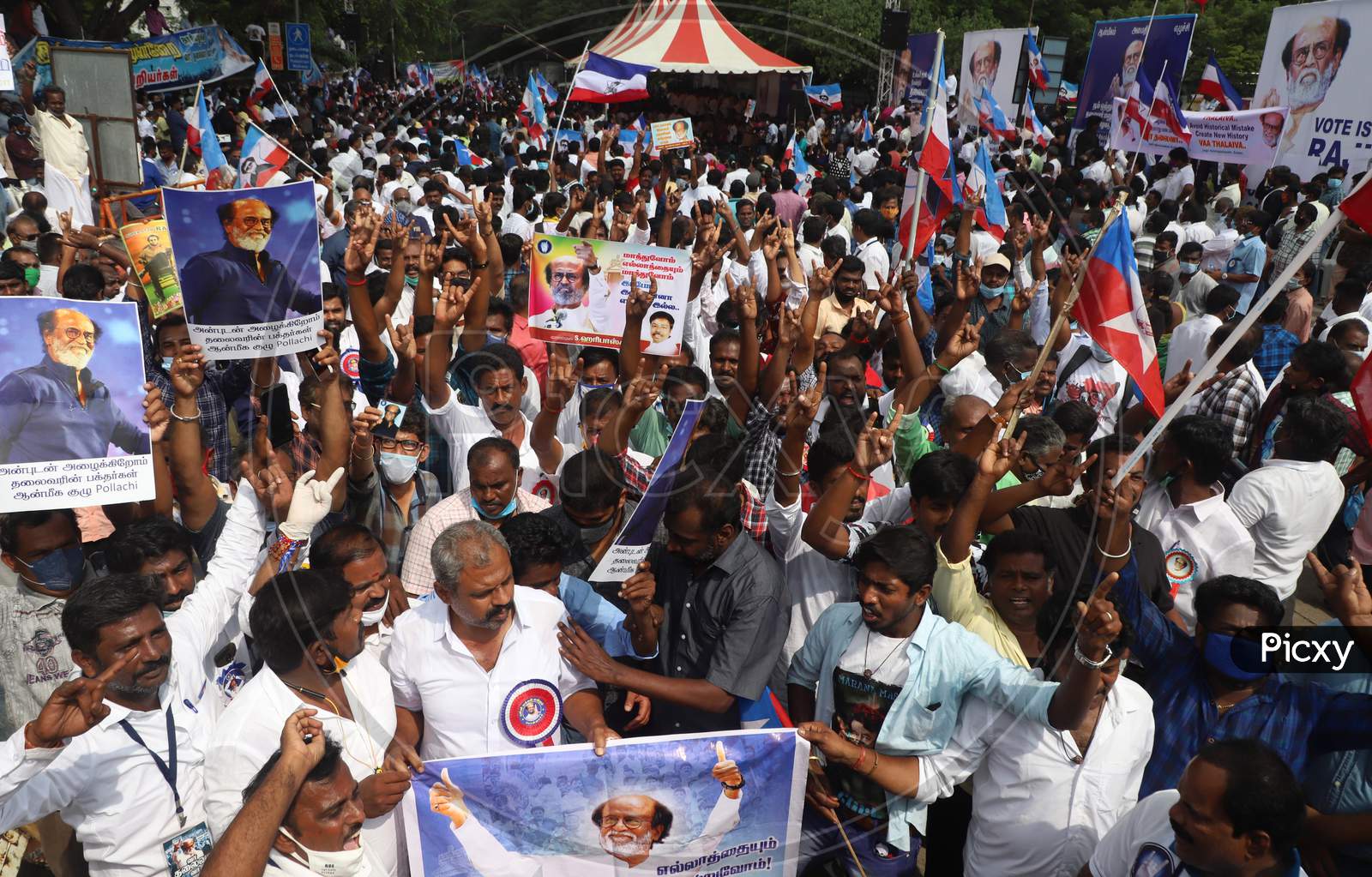 Fans of superstar Rajinikanth stage a demonstration demanding from him to join politics as earlier as promised, at Valluvar Kottam in Chennai, Sunday, Jan. 10, 2021. The actor, who finally appeared ready to launch his political party with a "now or never" announcement about a month ago, has now deci