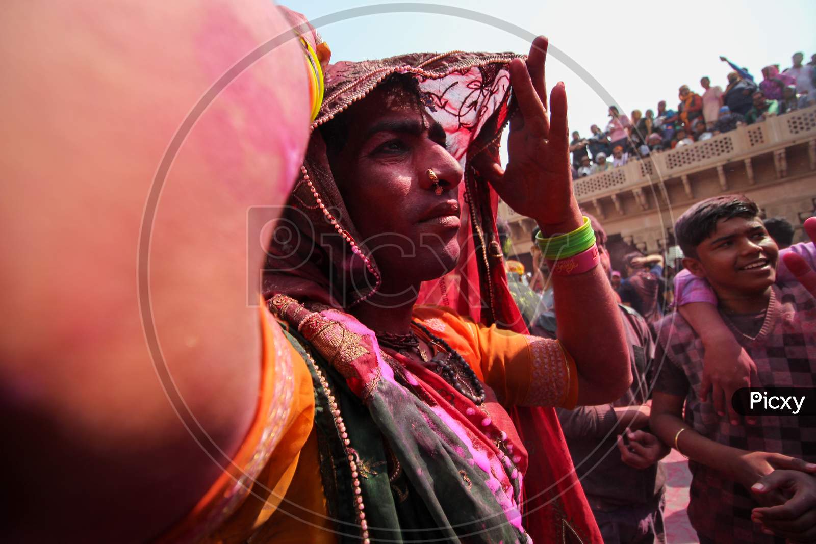 Mathura, Uttar Pradesh/ India- January 6 2020: Unidentified Transgender Or Hijra Wearing Saree Hiding His Face And Celebrating The Traditional, Ritualistic Holi At Radha Rani Temple. Participate In The Colorful Holi Celebration In Mathura.