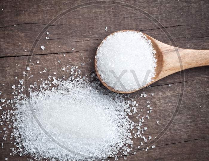 Sugar In A Wooden Spoon