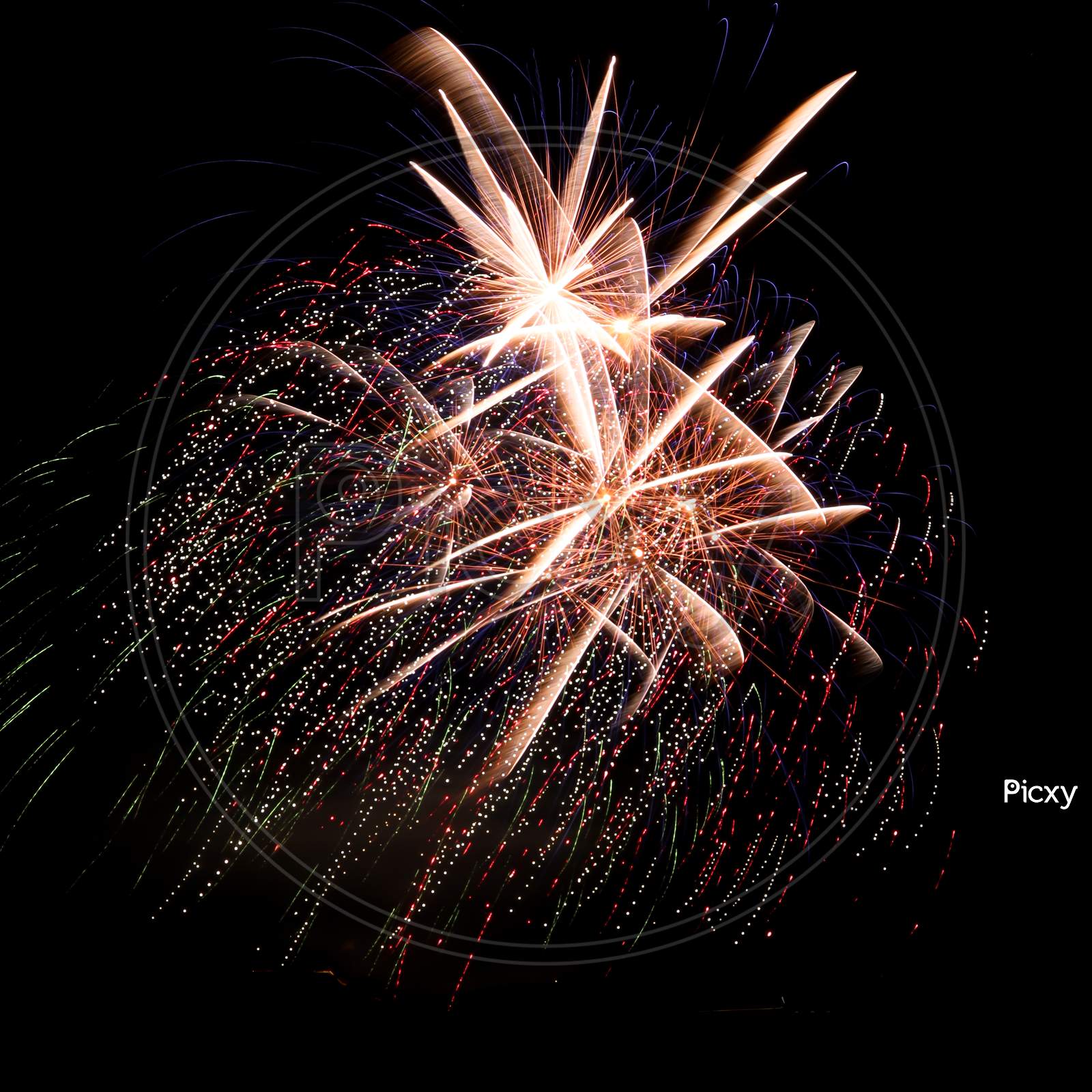 Bright Gold Fireworks With Streaks Of Color In The Background