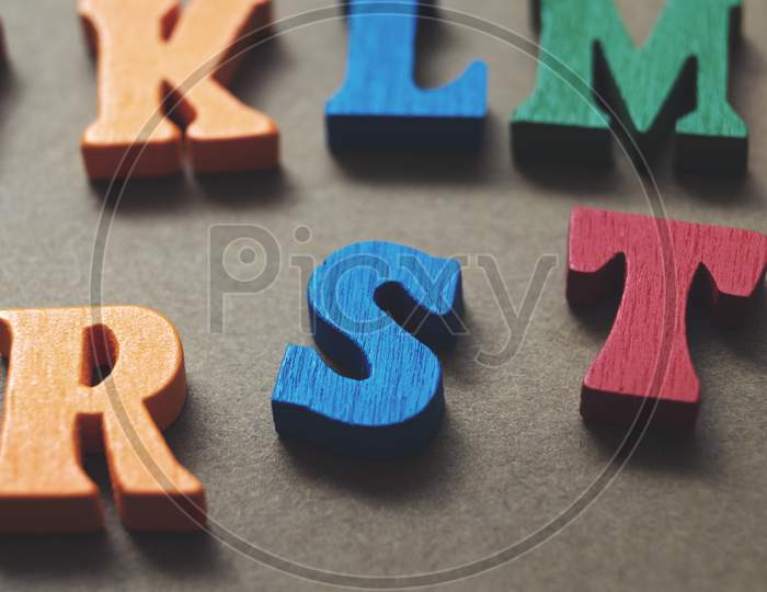 Colorful Wooden Letters On Wooden Background