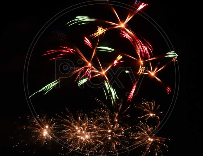 Pinwheels Of Fireworks In The Night Sky