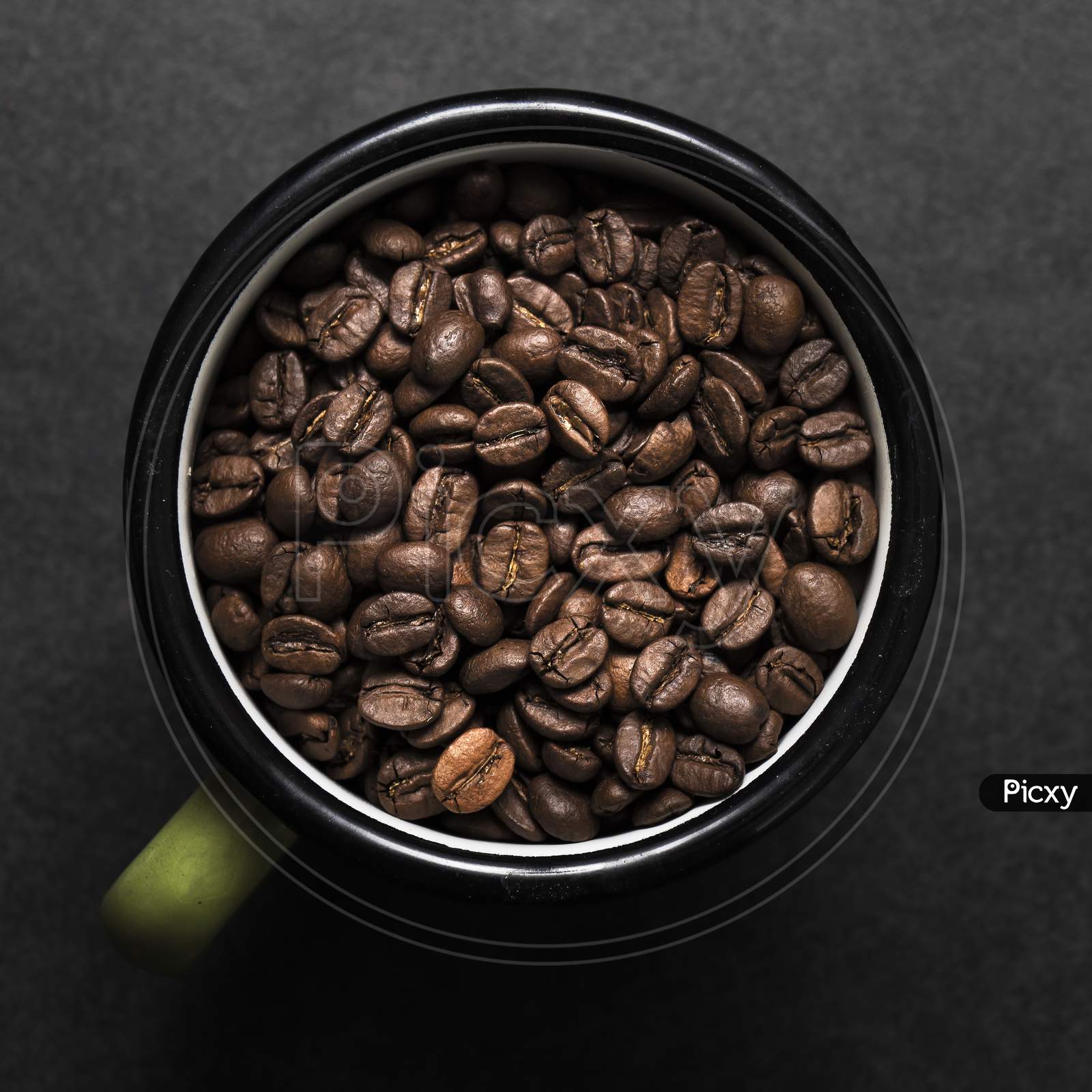 Fresh Roasted Coffee Beans In Metal Coffee Cup