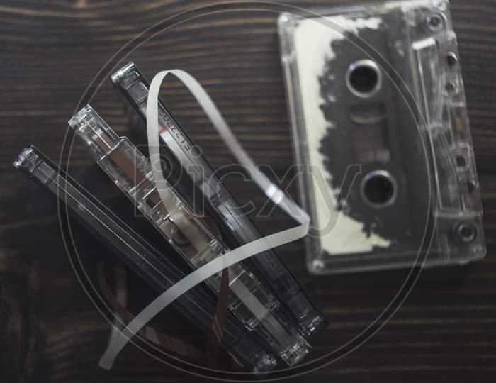 Retro Tape Cassette Over Wooden Table