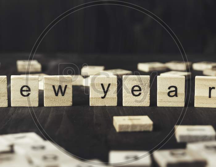 New Year Concept - ‘ New Year’ Written On Wooden Blocks.