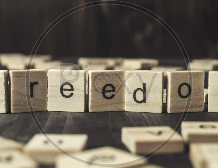 Word  Freedom Written On Wooden Blocks