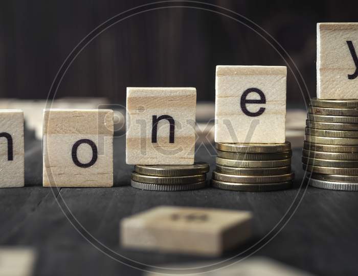Coins On Stack Stair As Step Growing Growth And Wooden Cube Block With Word Money