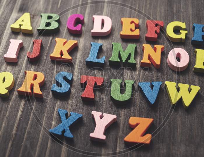 Wooden Alphabet Letters On Wooden Background