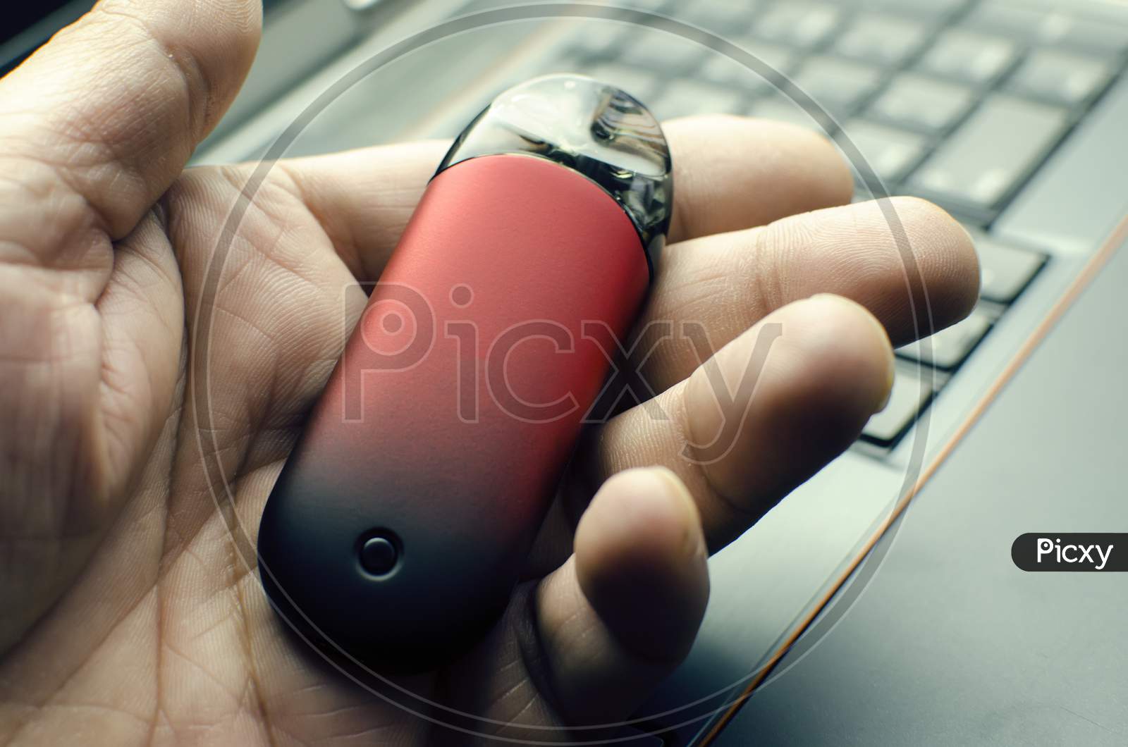Vape Pod In Male Hand Or Pod Mod With Changeable Cartridges Close Up