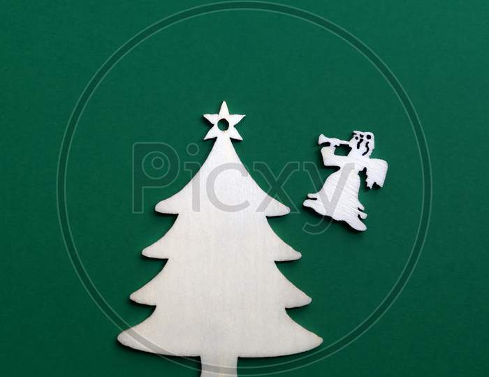 Wooden Christmas Decoration On Green Background.