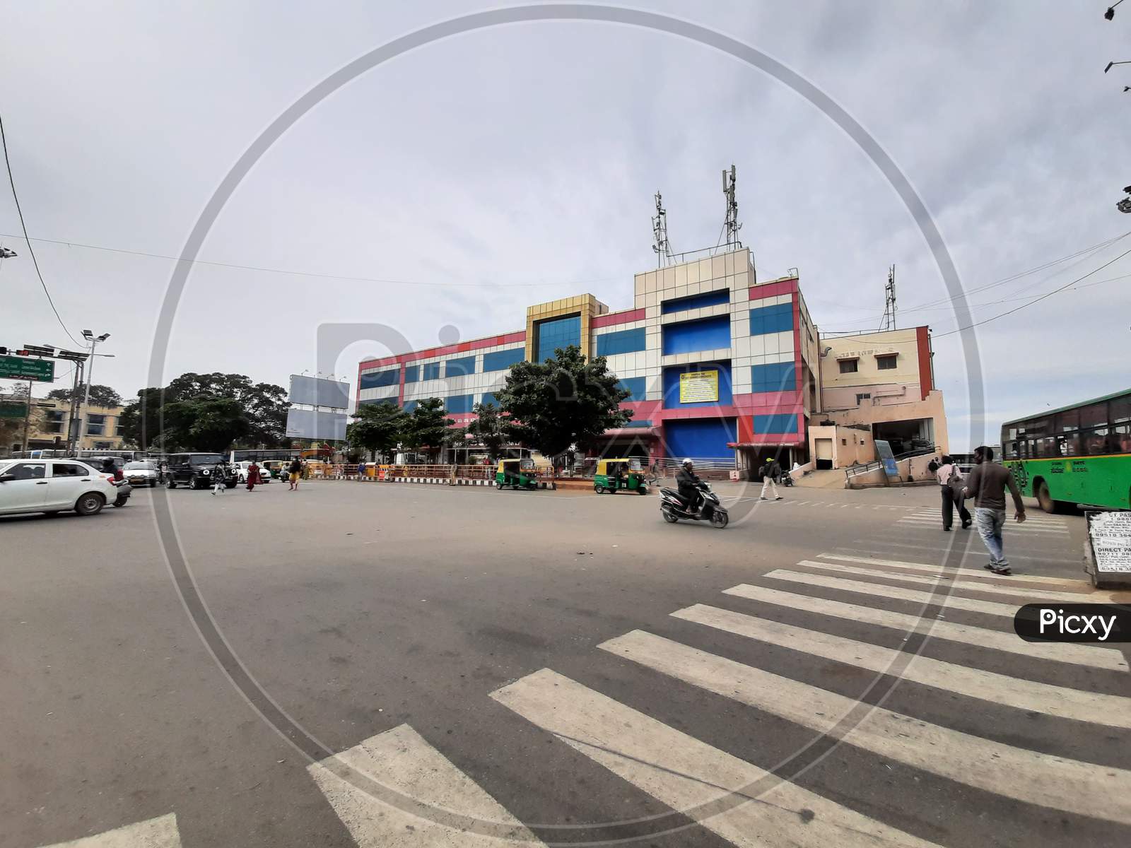Beautiful view of Banashankari BMTC Bus Stand Building and Metro Station. One Side Vehicles are moving in the Circle.