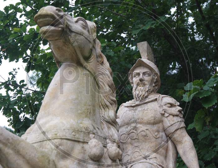White Marble Statue Of An Ancient Man Riding A Horse