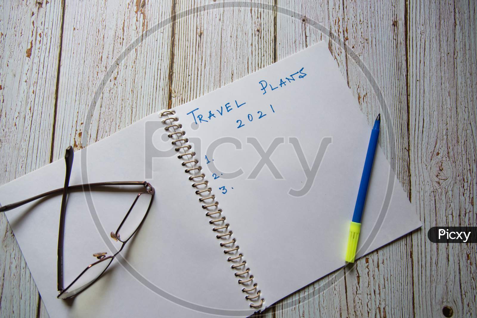 View from top of Travel Plans 2021 handwritten on notebook
