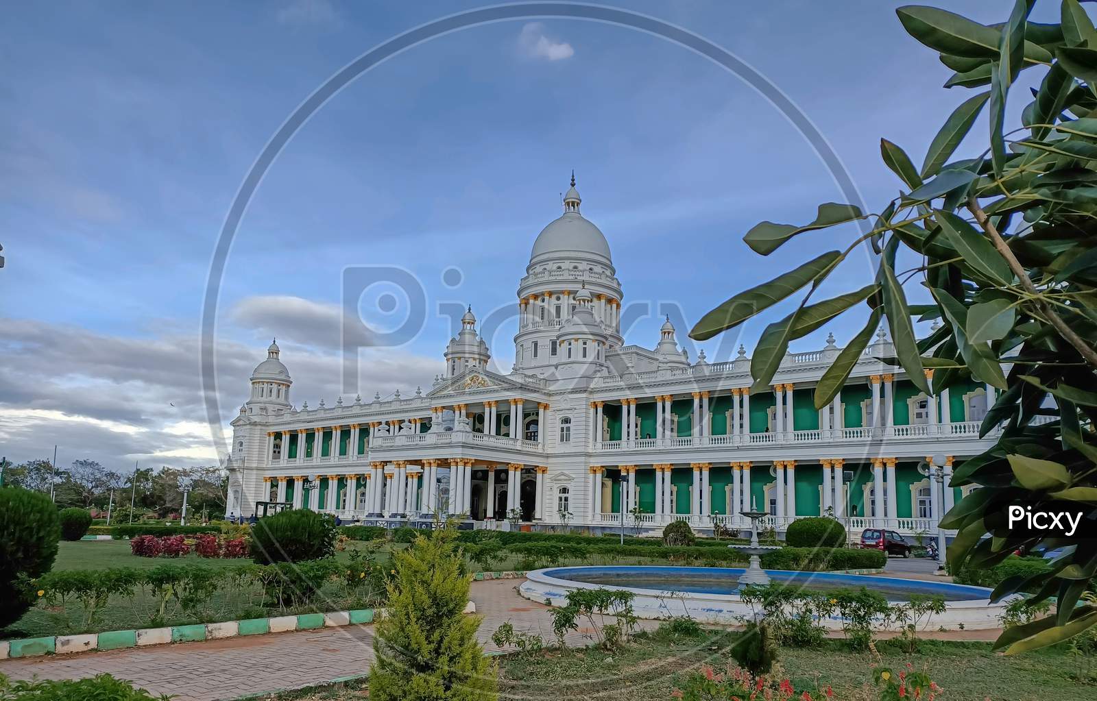 A Dramatic view of the Magnificent Lalitha Mahal Summer Palace in white color against the blue sky and the landscape at Mysuru,India.