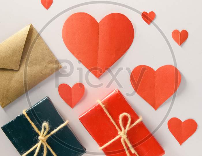 Valentine'S Day Background. Gifts, Candle, Confetti, Envelope On Pastel White Background. Valentines Day Concept. Flat Lay, Top View, Copy Space